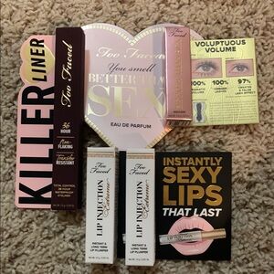 Too Faced Makeup Bundle with eyeliner, mascara, lip plumper and perfume sample